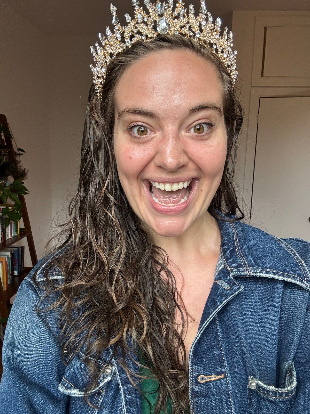 Jillian Richardson grinning in a tiara and denim jacket